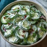 Creamy Cucumber Salad with Dill and Greek Yogurt, featuring cool cucumbers in a smooth, herb-infused Greek yogurt dressing.
