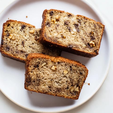 Enjoy the delicious aroma of freshly baked Simple Banana Bread, perfect for breakfast.