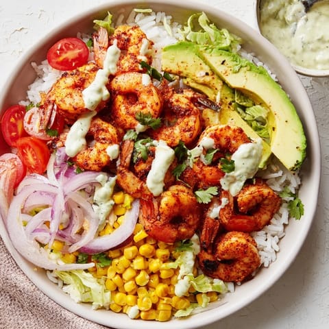 Flavorful Cajun Shrimp Taco Bowls with juicy, pink shrimp nestled on a bed of fluffy white rice.