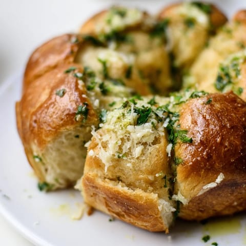 Golden Garlic Butter Bread Pull-Apart in a skillet, served warm for a family-style dinner.