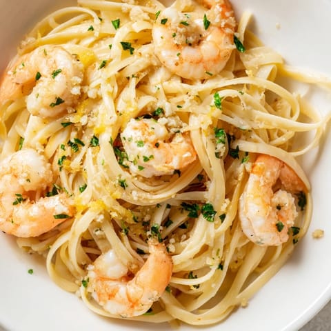 Hearty Garlic Butter Shrimp Linguine glistening with lemon zest, served warm with a side salad and optional Parmesan for a perfect weeknight meal.