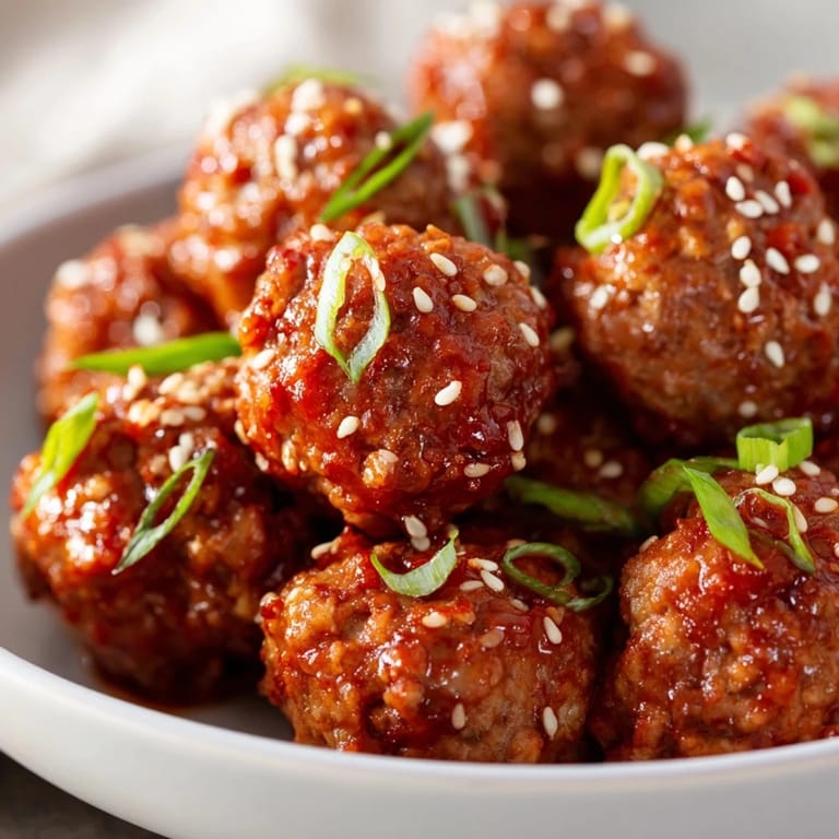 Savory Spicy Sriracha Honey Meatballs, a perfect appetizer, showcasing delicious Asian-American fusion flavors.