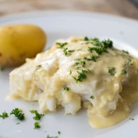 Flaky pieces of Norwegian Lutefisk, baked until tender, topped with creamy mustard sauce.